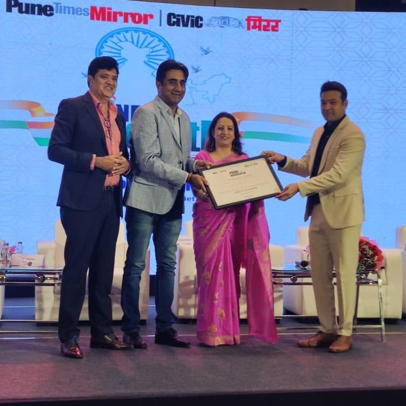 Mr and Mrs Sumbli accepting an award